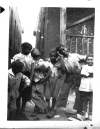 Photo Album, p. 9, Photo A "SOCIAL SUICIDE"  "These views depict a few of the chldren who live in the back alley of our civilization.  Their jovial smiles at being photographed reflects their innocence of what lies aheld in their struggle for existence."-- Walter and Victor Reuther