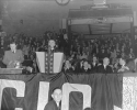 Ford Drive Olympia, 1939 General Motors Rally in Olympia, Detroit.

Standing at far left - Walter Reuther.  At the podium - John L. Lewis.  Seated at right Richard T. Leonard (?), Sidney Hillman, Philip Murray and R.J. Thomas.
