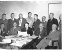 First meeting of Labor Management Policy Committee of the War Manpower Commission.  Seated L-R:  Fowler Harper, Deputy Chairman of WMC; R.Conrad Cooper, of Wheeling Steel Corp; Arthur S. Fleming, of Civil Service Commission, Chairman; Clinton S. Golden, United Steel Workers of America, C.I.O.; John P. Frey, A.F.L., President, Metal Trades.  Standing, L-R; R.E. Gillmor, President, Sperry Gyroscope Co.; R.Randall Irin, Director of Industrial Relations, Lockheed Aircraft Corp; H.A. Enochs, Cheif of Personal, Pa. R.R. Co.; Brig. Gen. Frank G. McSherry, Dir. of Operations, War Manpower Commission; Walter P. Reuther, Member of U.A.W., C.I.O.; George Masteron, Steam Fitters and Plumbers, A.F.L.; Joseph  S. McDonnagh, Sec. Treas., Building Trades, A.F.L." June 1942