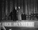 To celebrate the creation of the Internation Confederation of Free Trade Unions, Force Ouvriere organized a mass gathering and eveningr&squo;s entertainment at the Palasis de Chaillot in Paris, on December 11, 1949.  Several foreign trade union delegations who had participated in the London Congress were present at the gathering.  Here Walter Reuther, President of the United Automobile Workers, CIO, is speaking (right), aided by an interpreter.  December 11, 1949