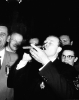 Walter Reuther taking a drink of beer at the 1952 CIO convention after he was elected president of the CIO.  Although he did not smoke or drink, Reuther promised to smoke a cigar and drink a beer if he won."1952"Photograper:  Allan Grant, LIFE Magazine