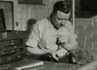 Walter Reuther at work in his basement workshop.