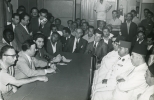 "Tunis, September 7, 1955 - In the headquarters of the Tunisian General Federation of Labor (UGTT), CIO President Walter P. Reuther brings CIO greetings to Tunisian workers filling the meeting hall and the square outside.  Opposite Reuther is Tunisia Prime Minister Tahar Ben Ammar, flanked by members of his cabinet.  On Reuther’s left is Ahmed Ben Salah, General Secretary of the UGTT, and on his right is Dan Benedict, CIO Associate Director of International Affairs."