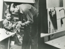 Walter and Linda Reuther working in their woodshop in the basement."