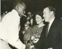 Walter P. Reuther shaking hands with unnamed figure.