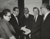 Walter Reuterh with a group of people.  Irving Bluestone shaking hands."